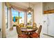Sunlit breakfast nook with large windows and a decorative light fixture at 316 W Anderson Ave, Phoenix, AZ 85023