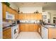 This kitchen features wooden cabinets, a white microwave, and lots of counter space at 316 W Anderson Ave, Phoenix, AZ 85023