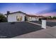 Charming home showcasing modern curb appeal with a spacious driveway and rock landscaping at 3506 W Yucca St, Phoenix, AZ 85029