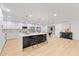 Spacious open-concept kitchen with an island, stainless steel appliances, and a dining area at 3506 W Yucca St, Phoenix, AZ 85029