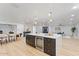 Open concept kitchen with a large island, seating, and a beverage refrigerator at 3506 W Yucca St, Phoenix, AZ 85029