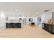 Bright open concept kitchen featuring a large island with seating, and updated appliances at 3506 W Yucca St, Phoenix, AZ 85029