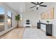 Well-lit office features wood floors, a ceiling fan, and a sliding glass door at 3506 W Yucca St, Phoenix, AZ 85029