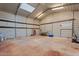 Spacious workshop with a concrete floor, whiteboard, and ample storage at 3506 W Yucca St, Phoenix, AZ 85029