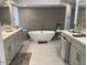 Luxurious bathroom with a standalone tub, double vanities, and contemporary fixtures at 41576 N 107Th Way, Scottsdale, AZ 85262