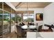 Bright breakfast nook with banquette seating, glass table, and mountain views through large windows at 41576 N 107Th Way, Scottsdale, AZ 85262