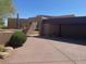 Contemporary home exterior with neutral color palette, desert landscaping and a spacious driveway at 41576 N 107Th Way, Scottsdale, AZ 85262