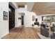 Light-filled foyer with wood floors, artwork, view windows and a seamless flow to the living spaces at 41576 N 107Th Way, Scottsdale, AZ 85262