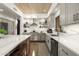 Open kitchen features gray cabinets, quartz countertops, stainless steel appliances, and a wood plank ceiling at 41576 N 107Th Way, Scottsdale, AZ 85262