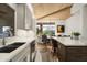 Bright eat-in kitchen features gray cabinets, quartz counters, breakfast nook, and a view of the outdoors at 41576 N 107Th Way, Scottsdale, AZ 85262