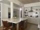 Well-lit kitchen with a central island, sleek stainless steel appliances, and ample cabinet space at 41576 N 107Th Way, Scottsdale, AZ 85262