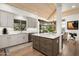 Modern kitchen with stone counters, stainless steel appliances and a breakfast bar at 41576 N 107Th Way, Scottsdale, AZ 85262