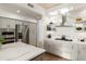 Spacious kitchen with stainless steel appliances, quartz countertops, and ample cabinet storage space at 41576 N 107Th Way, Scottsdale, AZ 85262