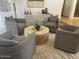 Comfortable living room with four armchairs, a textured rug, and a wooden coffee table at 41576 N 107Th Way, Scottsdale, AZ 85262
