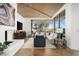 Stylish living room featuring vaulted wood ceilings, large windows, and comfortable, neutral furniture at 41576 N 107Th Way, Scottsdale, AZ 85262