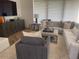 Cozy living room with comfortable seating, a stylish rug, and an entertainment center at 41576 N 107Th Way, Scottsdale, AZ 85262