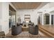 Relaxing living space with wood floors, comfortable seating, view windows, and access to the kitchen at 41576 N 107Th Way, Scottsdale, AZ 85262