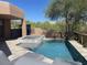 Sparkling private pool and spa surrounded by lush landscaping offer a perfect escape for leisure and recreation at 41576 N 107Th Way, Scottsdale, AZ 85262