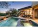 Luxurious backyard featuring a pool, spa, and outdoor living space perfect for relaxing and entertaining at 41576 N 107Th Way, Scottsdale, AZ 85262