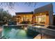 Backyard with a sparkling pool and spa offering a luxurious outdoor living experience with seamless indoor/outdoor flow at 41576 N 107Th Way, Scottsdale, AZ 85262