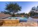 Backyard pool and spa surrounded by desert foliage with plenty of space for lounging and entertaining at 41576 N 107Th Way, Scottsdale, AZ 85262