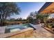 Resort-style backyard featuring a pool, spa, and desert landscaping providing a tranquil retreat at 41576 N 107Th Way, Scottsdale, AZ 85262