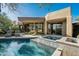 Gorgeous pool and spa with desert landscaping, lounge seating, and modern home exterior at 41576 N 107Th Way, Scottsdale, AZ 85262