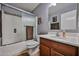 Clean bathroom featuring a shower with glass doors, a modern sink, and neutral tones at 4318 W Apollo Rd, Laveen, AZ 85339