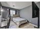 Modern bedroom featuring gray walls, tiled floors, and a view of the TV at 4318 W Apollo Rd, Laveen, AZ 85339