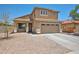 Charming two-story home featuring a neutral color palette, tile roof, and a two-car garage at 4318 W Apollo Rd, Laveen, AZ 85339