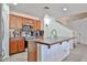 Well-lit kitchen featuring an island with a sink and stainless steel appliances at 4318 W Apollo Rd, Laveen, AZ 85339