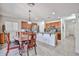 Bright kitchen with wood cabinets, stainless steel appliances, and an adjacent dining area at 4318 W Apollo Rd, Laveen, AZ 85339