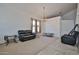 Large living room featuring tile flooring, comfortable seating, and plenty of natural light at 4318 W Apollo Rd, Laveen, AZ 85339