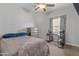 Bedroom with gray walls, carpet, a large window and a queen size bed at 455 W Evergreen Pear Ave, Queen Creek, AZ 85140