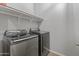 Laundry room featuring a washer, dryer, and shelf at 455 W Evergreen Pear Ave, Queen Creek, AZ 85140