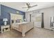 Serene bedroom featuring an oversized bed, neutral decor, carpet flooring, and great natural lighting at 455 W Evergreen Pear Ave, Queen Creek, AZ 85140