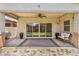 Covered outdoor patio featuring ceiling fan, string lights and access to grassy backyard at 455 W Evergreen Pear Ave, Queen Creek, AZ 85140