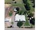 An aerial perspective shows the ranch home surrounded by expansive land and mature trees at 5016 W Sunrise Dr, Laveen, AZ 85339