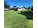 Expansive backyard with well-maintained lawn and mature trees, perfect for outdoor entertaining and recreation at 5016 W Sunrise Dr, Laveen, AZ 85339