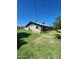 Wide backyard featuring a well-kept lawn, mature trees, and potential for garden or landscape design at 5016 W Sunrise Dr, Laveen, AZ 85339