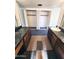 Bathroom featuring dual sinks, large mirrors, and open closet space at 5016 W Sunrise Dr, Laveen, AZ 85339