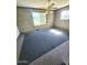 Bedroom with brick accent wall, carpet flooring, and two large windows at 5016 W Sunrise Dr, Laveen, AZ 85339