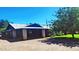 Spacious property with a covered parking area, lush landscaping, and a well-maintained lawn at 5016 W Sunrise Dr, Laveen, AZ 85339