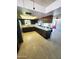 Spacious kitchen featuring wooden cabinetry, ample countertop space, and tile flooring at 5016 W Sunrise Dr, Laveen, AZ 85339