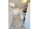 Functional laundry room with washer, dryer, dark wood cabinets, and ample lighting at 5016 W Sunrise Dr, Laveen, AZ 85339