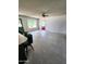 Open living space with large window, ceiling fan, and tile flooring at 5016 W Sunrise Dr, Laveen, AZ 85339