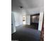 Bright living room featuring neutral carpets and white walls, offering a versatile space for relaxation and entertainment at 5016 W Sunrise Dr, Laveen, AZ 85339