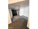 Comfortable living room with neutral carpeting and black double doors, offering a versatile space at 5016 W Sunrise Dr, Laveen, AZ 85339