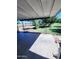 Relaxing covered patio with concrete floor, perfect for outdoor entertaining and enjoying the beautifully landscaped surroundings at 5016 W Sunrise Dr, Laveen, AZ 85339