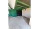 Covered patio with green accents leading to a black gated entrance, offers an inviting outdoor space at 5016 W Sunrise Dr, Laveen, AZ 85339
